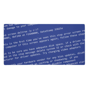 A nostalgic blue screen of death sprawls across this desk mat, featuring cascading white error messages in retro monospaced font tilted at a panic-inducing diagonal. Contact us with accessibility feedback, we'd love to help!