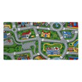 A nostalgic children's play rug design sprawls across this desk mat, featuring a vector-style town map with winding asphalt grey roads marked by white lane dividers. Contact us with accessibility feedback, we'd love to help!