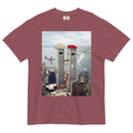 Funhouse 911 T-Shirt - The anthropomorphized grey monoliths wearing a beige (#D2B48C) western hat and crimson (#DC143C) beret superimposed over the recognizable skyline, with chaotic elements like a safety orange (#FF4500) slide and approaching aircraft evoking surreal, meme-inspired absurdity