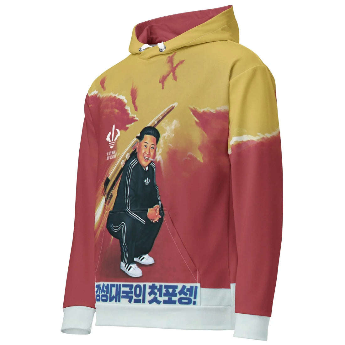 A smiling supreme leader squats in a retro ink-black tracksuit (lit cigarette included) against a painterly horizon of dusty mustard gold and revolutionary crimson. Contact us with accessibility feedback, we'd love to help!