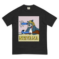 A midnight black tee showcases a cel-shaded slate blue cartoon cat (white paws, shocked expression) wearing a shaggy blonde grunge wig. Contact us with accessibility feedback, we'd love to help!