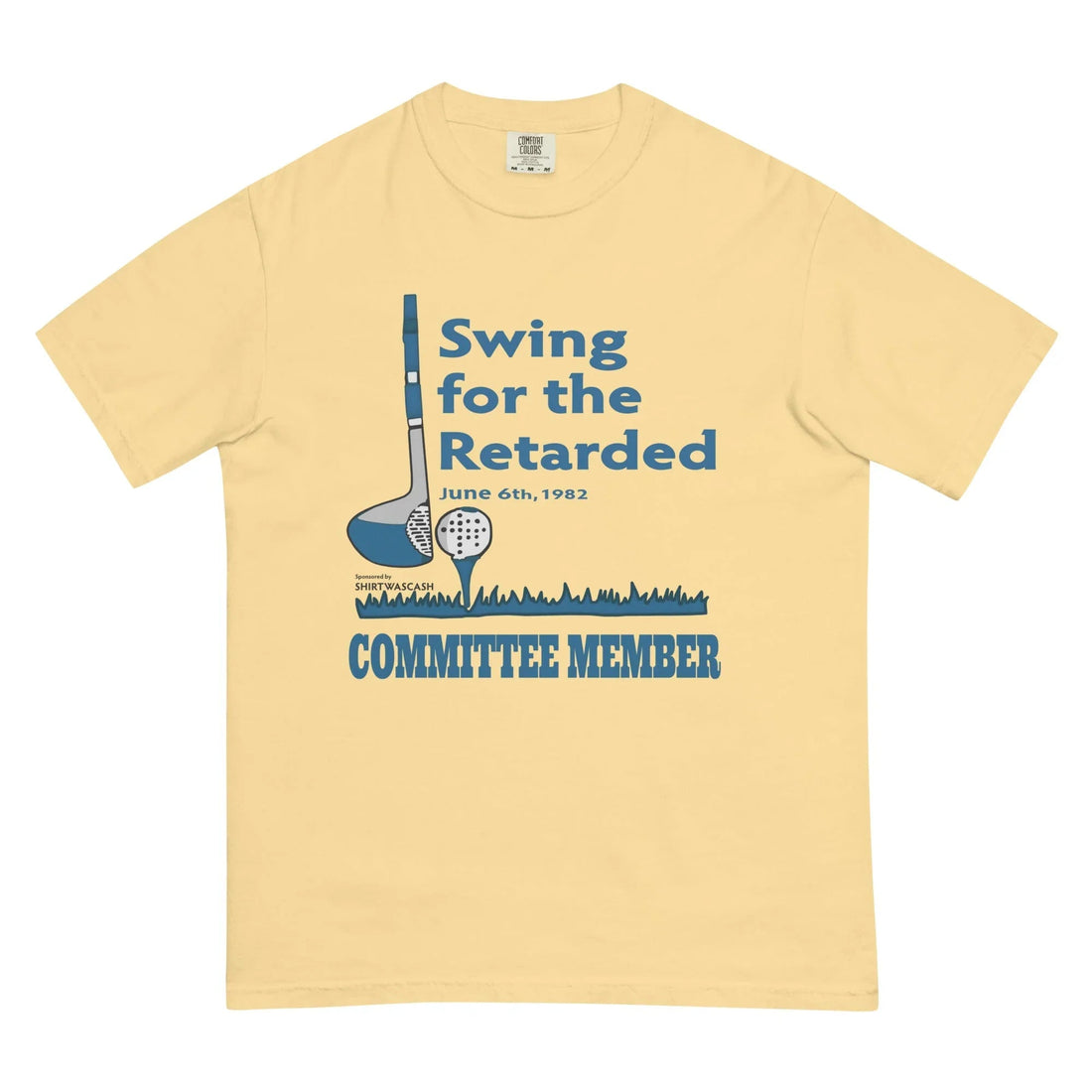 Swing For The Retarded T-Shirt - The stark juxtaposition of the innocent dusty azure (#3E6D9C) golf iconography with cool grey accents (#D9D9D9) against the now-taboo terminology of the 1982 event title, all set on a soft pale buttercream base (#F2E3B1).
